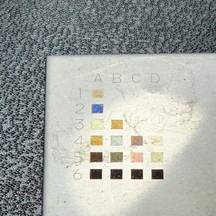 The top-left corner of the placard cropped on the colour chart